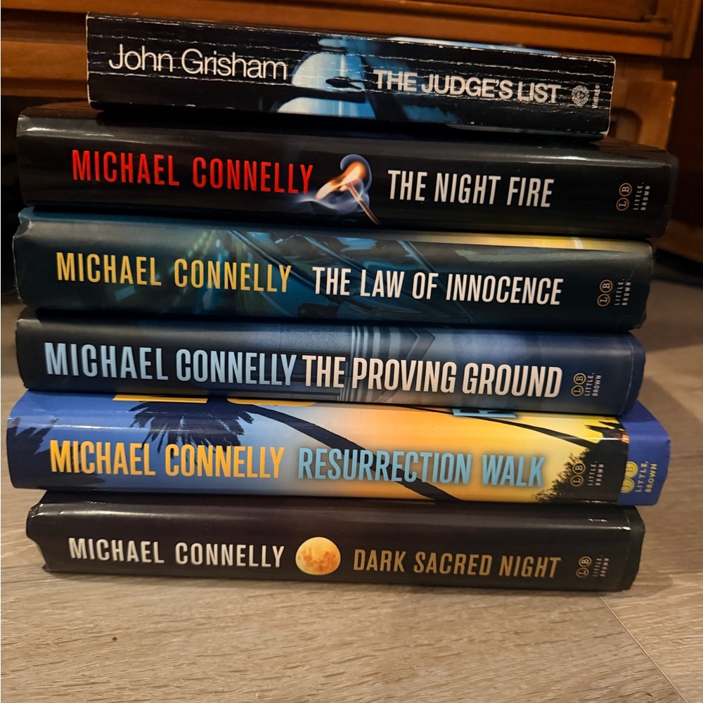 Stack of Michael Connelly Hardcover Books with John Grisham Paperback